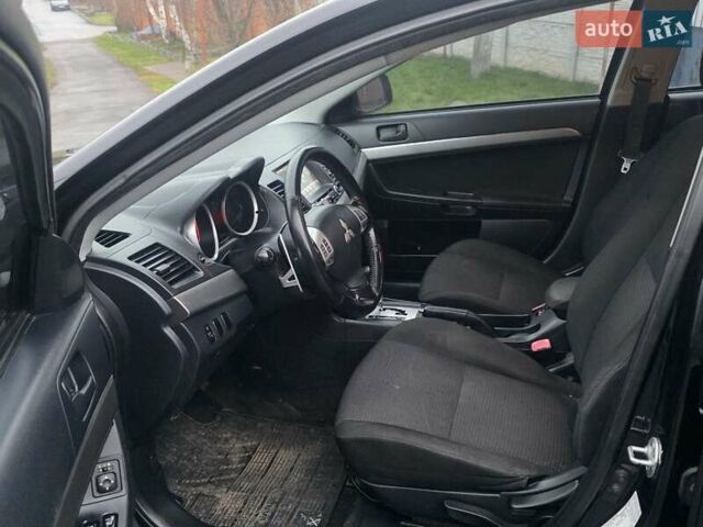 Черный Мицубиси Лансер, объемом двигателя 2 л и пробегом 116 тыс. км за 7200 $, фото 6 на Automoto.ua