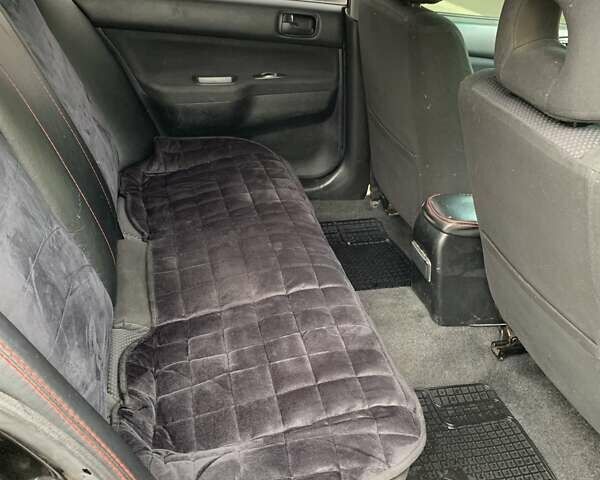 Черный Мицубиси Лансер, объемом двигателя 1.6 л и пробегом 164 тыс. км за 5200 $, фото 7 на Automoto.ua