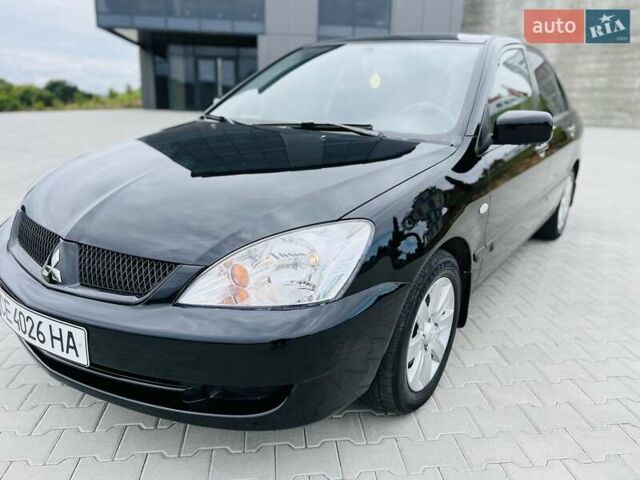 Чорний Міцубісі Lancer, об'ємом двигуна 1.6 л та пробігом 243 тис. км за 4950 $, фото 28 на Automoto.ua