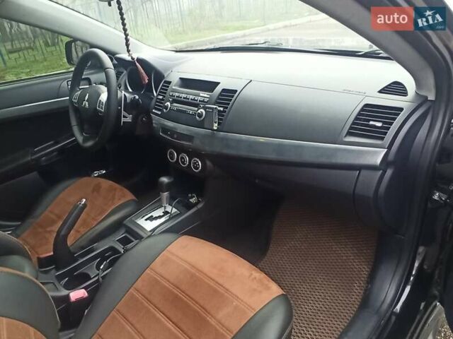 Черный Мицубиси Лансер, объемом двигателя 2 л и пробегом 195 тыс. км за 7899 $, фото 14 на Automoto.ua