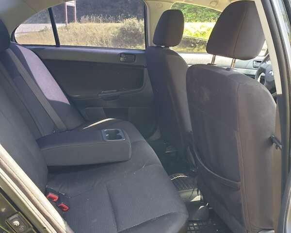 Черный Мицубиси Лансер, объемом двигателя 1.5 л и пробегом 240 тыс. км за 6900 $, фото 4 на Automoto.ua