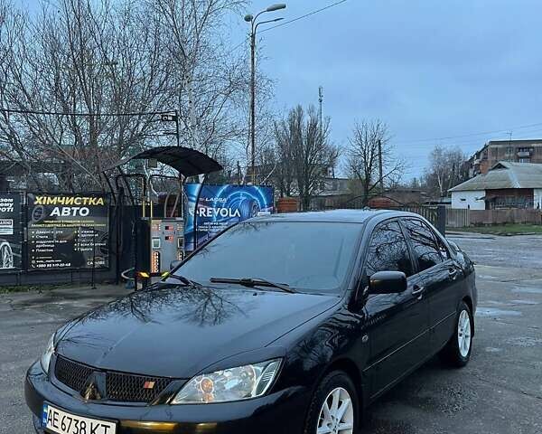 Черный Мицубиси Лансер, объемом двигателя 1.6 л и пробегом 249 тыс. км за 5000 $, фото 1 на Automoto.ua