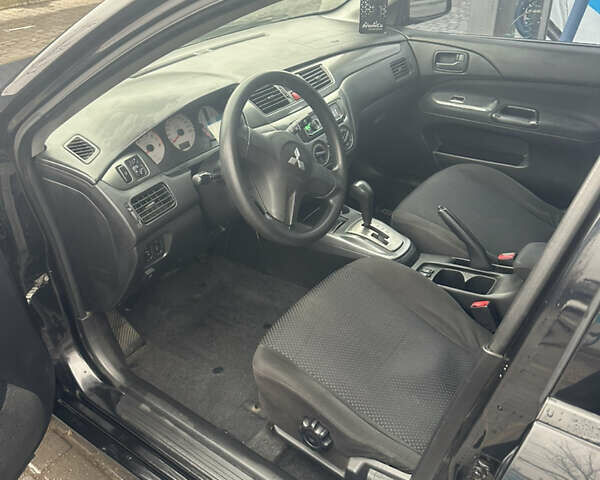 Чорний Міцубісі Lancer, об'ємом двигуна 1.6 л та пробігом 270 тис. км за 4500 $, фото 3 на Automoto.ua