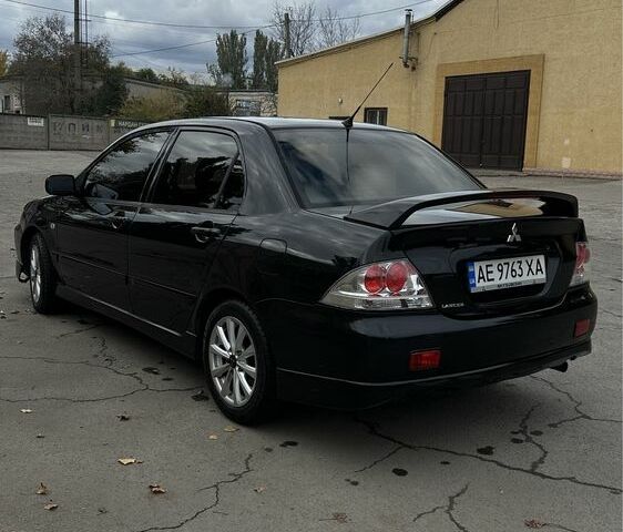 Чорний Міцубісі Lancer, об'ємом двигуна 2 л та пробігом 143 тис. км за 5400 $, фото 2 на Automoto.ua