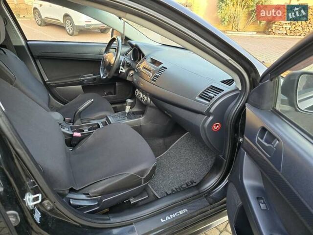 Чорний Міцубісі Lancer, об'ємом двигуна 2 л та пробігом 260 тис. км за 6555 $, фото 39 на Automoto.ua