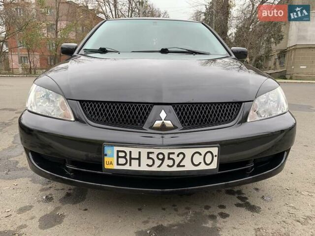 Черный Мицубиси Лансер, объемом двигателя 1.6 л и пробегом 164 тыс. км за 5200 $, фото 5 на Automoto.ua