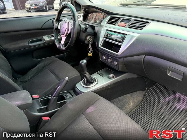 Черный Мицубиси Лансер, объемом двигателя 1.6 л и пробегом 260 тыс. км за 3700 $, фото 8 на Automoto.ua