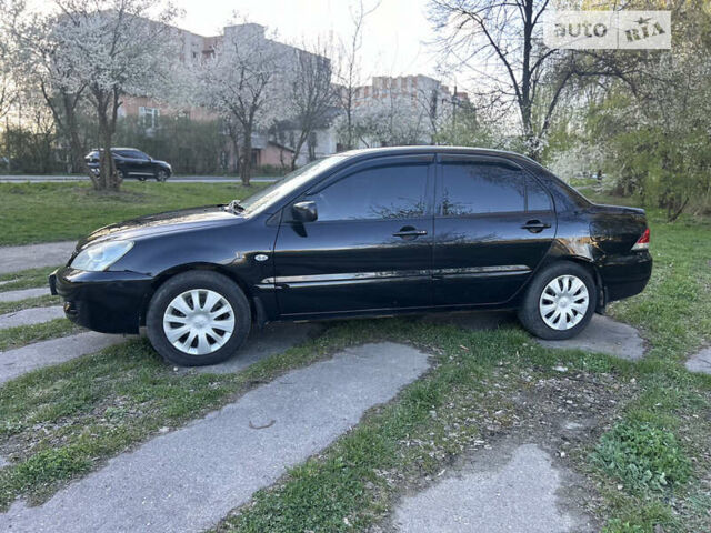 Чорний Міцубісі Lancer, об'ємом двигуна 1.58 л та пробігом 161 тис. км за 5300 $, фото 6 на Automoto.ua