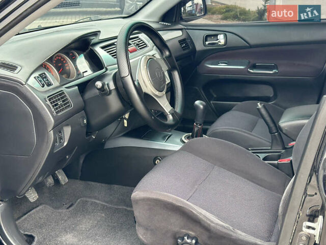 Чорний Міцубісі Lancer, об'ємом двигуна 2 л та пробігом 275 тис. км за 5300 $, фото 38 на Automoto.ua