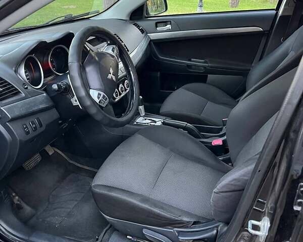 Чорний Міцубісі Lancer, об'ємом двигуна 2 л та пробігом 230 тис. км за 6800 $, фото 7 на Automoto.ua