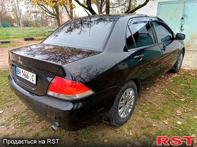 Чорний Міцубісі Lancer, об'ємом двигуна 1.6 л та пробігом 227 тис. км за 4100 $, фото 4 на Automoto.ua