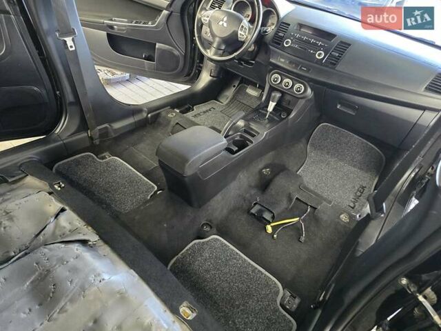 Черный Мицубиси Лансер, объемом двигателя 2 л и пробегом 260 тыс. км за 6555 $, фото 48 на Automoto.ua