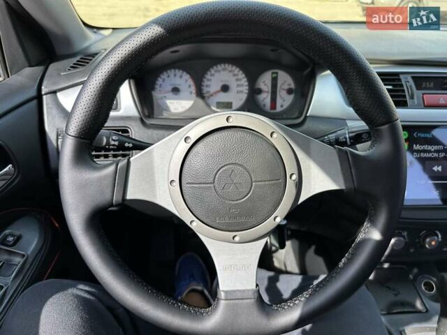 Черный Мицубиси Лансер, объемом двигателя 2 л и пробегом 272 тыс. км за 5514 $, фото 6 на Automoto.ua