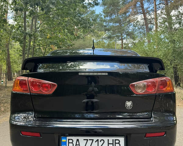 Черный Мицубиси Лансер, объемом двигателя 2 л и пробегом 245 тыс. км за 6800 $, фото 3 на Automoto.ua