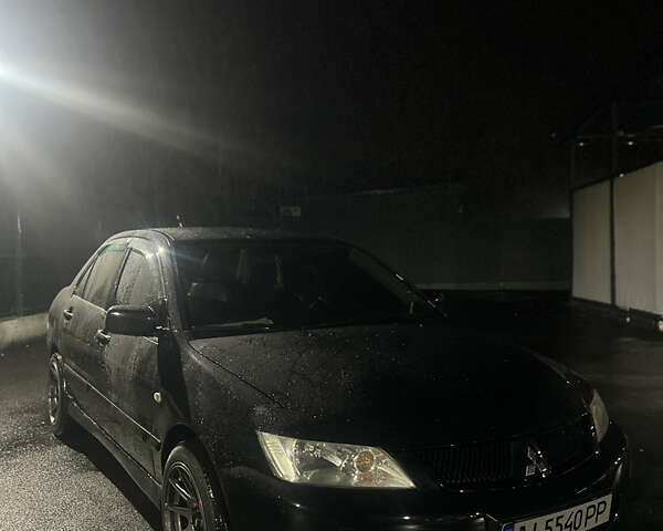 Черный Мицубиси Лансер, объемом двигателя 1.6 л и пробегом 211 тыс. км за 5700 $, фото 15 на Automoto.ua