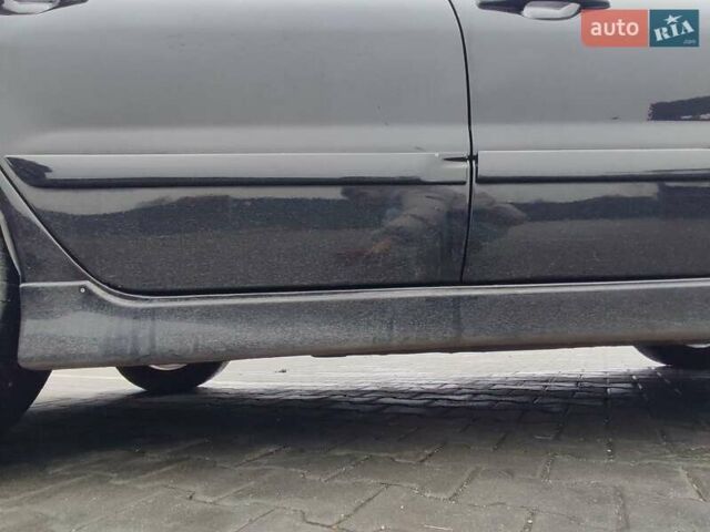 Чорний Міцубісі Lancer, об'ємом двигуна 2 л та пробігом 145 тис. км за 5000 $, фото 11 на Automoto.ua