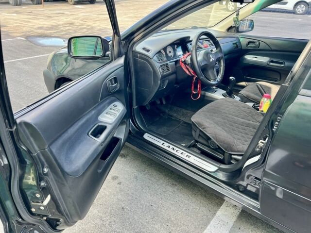 Чорний Міцубісі Lancer, об'ємом двигуна 1.6 л та пробігом 228 тис. км за 3499 $, фото 2 на Automoto.ua