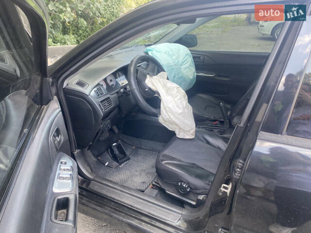 Чорний Міцубісі Lancer, об'ємом двигуна 1.6 л та пробігом 397 тис. км за 1500 $, фото 6 на Automoto.ua