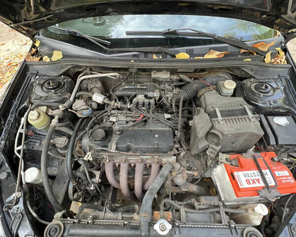 Чорний Міцубісі Lancer, об'ємом двигуна 1.58 л та пробігом 234 тис. км за 3800 $, фото 14 на Automoto.ua