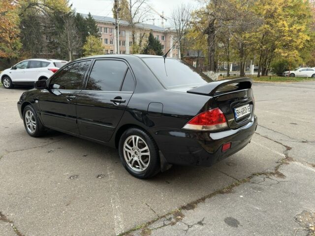 Черный Мицубиси Лансер, объемом двигателя 1.6 л и пробегом 173 тыс. км за 4700 $, фото 2 на Automoto.ua