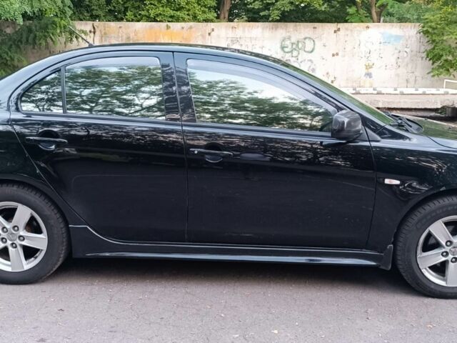 Черный Мицубиси Лансер, объемом двигателя 2 л и пробегом 210 тыс. км за 6000 $, фото 4 на Automoto.ua