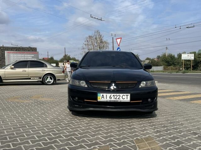 Черный Мицубиси Лансер, объемом двигателя 2 л и пробегом 224 тыс. км за 5800 $, фото 4 на Automoto.ua
