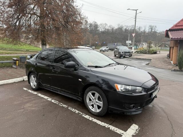 Черный Мицубиси Лансер, объемом двигателя 2 л и пробегом 281 тыс. км за 6000 $, фото 4 на Automoto.ua