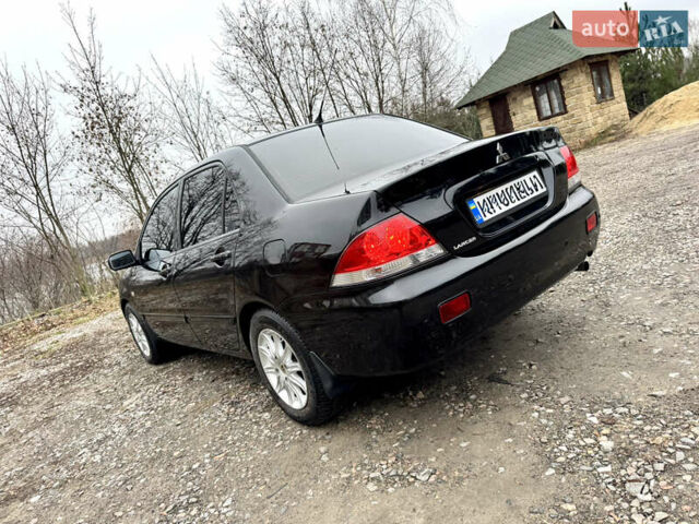 Черный Мицубиси Лансер, объемом двигателя 1.6 л и пробегом 216 тыс. км за 4990 $, фото 2 на Automoto.ua