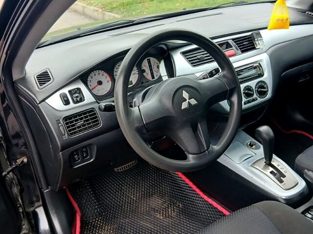 Чорний Міцубісі Lancer, об'ємом двигуна 1.6 л та пробігом 240 тис. км за 4700 $, фото 4 на Automoto.ua