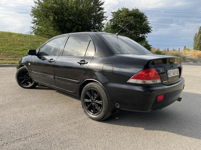 Чорний Міцубісі Lancer, об'ємом двигуна 1.6 л та пробігом 260 тис. км за 4600 $, фото 4 на Automoto.ua