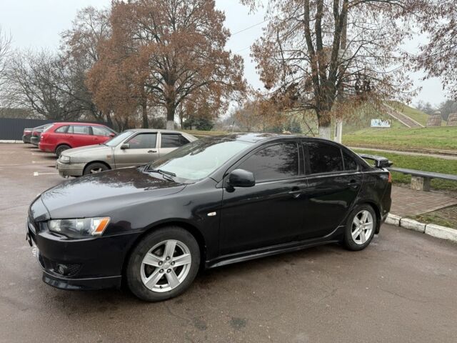 Черный Мицубиси Лансер, объемом двигателя 2 л и пробегом 281 тыс. км за 6000 $, фото 2 на Automoto.ua