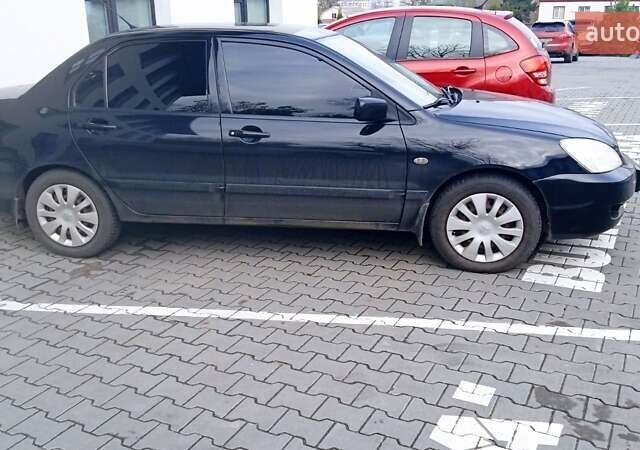 Черный Мицубиси Лансер, объемом двигателя 1.6 л и пробегом 223 тыс. км за 4300 $, фото 2 на Automoto.ua