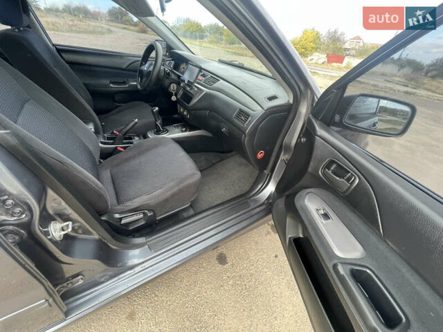 Чорний Міцубісі Lancer, об'ємом двигуна 1.6 л та пробігом 162 тис. км за 4650 $, фото 14 на Automoto.ua