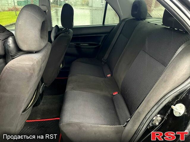Чорний Міцубісі Lancer, об'ємом двигуна 1.6 л та пробігом 196 тис. км за 3900 $, фото 11 на Automoto.ua