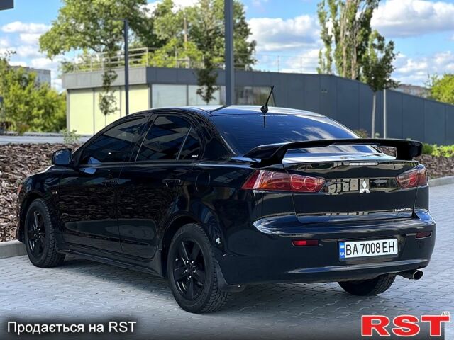 Чорний Міцубісі Lancer, об'ємом двигуна 2 л та пробігом 205 тис. км за 6500 $, фото 4 на Automoto.ua