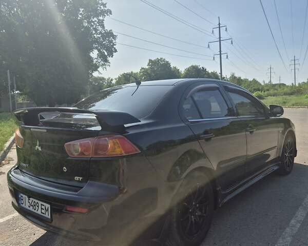 Чорний Міцубісі Lancer, об'ємом двигуна 2 л та пробігом 243 тис. км за 6600 $, фото 3 на Automoto.ua