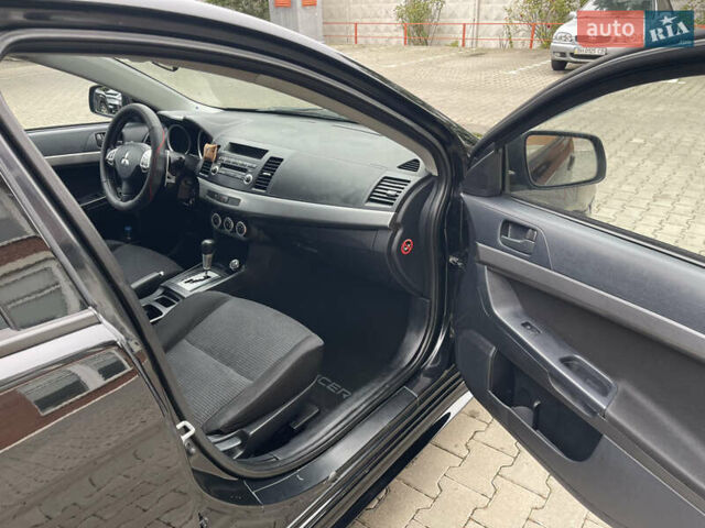 Черный Мицубиси Лансер, объемом двигателя 2 л и пробегом 200 тыс. км за 6199 $, фото 9 на Automoto.ua