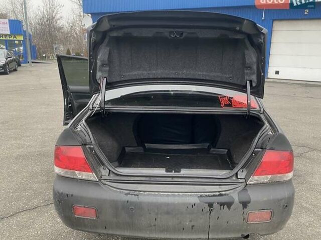 Черный Мицубиси Лансер, объемом двигателя 1.58 л и пробегом 263 тыс. км за 4000 $, фото 5 на Automoto.ua