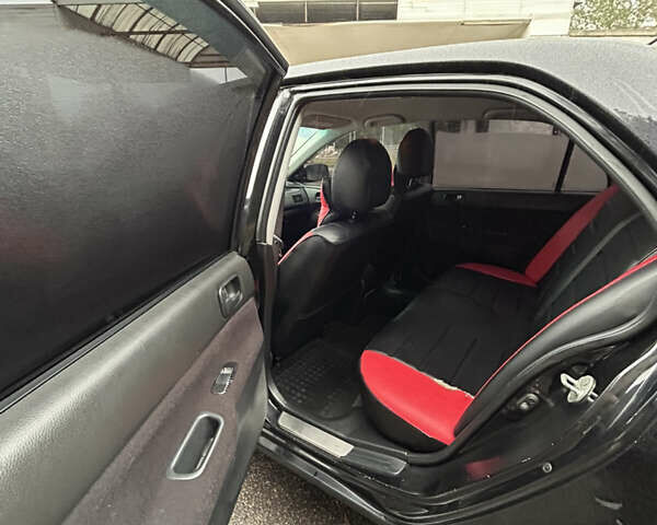 Черный Мицубиси Лансер, объемом двигателя 1.58 л и пробегом 254 тыс. км за 5000 $, фото 16 на Automoto.ua