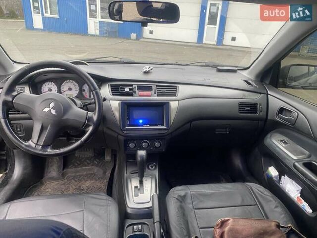 Черный Мицубиси Лансер, объемом двигателя 1.58 л и пробегом 263 тыс. км за 4000 $, фото 7 на Automoto.ua