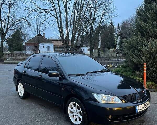 Черный Мицубиси Лансер, объемом двигателя 1.6 л и пробегом 249 тыс. км за 5000 $, фото 2 на Automoto.ua