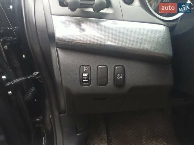 Черный Мицубиси Лансер, объемом двигателя 2 л и пробегом 195 тыс. км за 7899 $, фото 16 на Automoto.ua