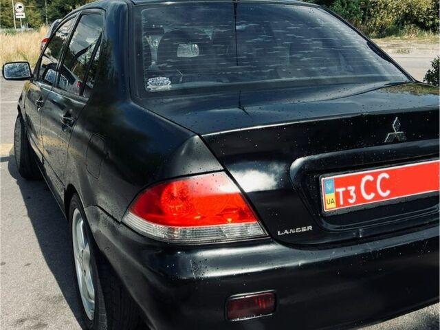 Чорний Міцубісі Lancer, об'ємом двигуна 1.6 л та пробігом 228 тис. км за 3300 $, фото 3 на Automoto.ua