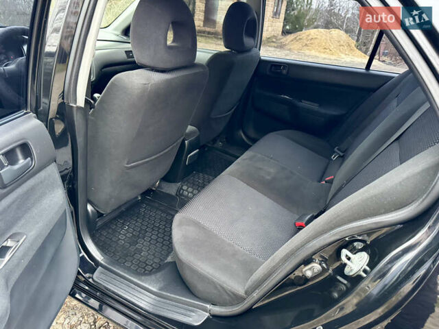 Черный Мицубиси Лансер, объемом двигателя 1.6 л и пробегом 216 тыс. км за 4990 $, фото 13 на Automoto.ua