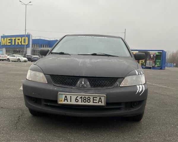 Черный Мицубиси Лансер, объемом двигателя 1.58 л и пробегом 263 тыс. км за 4000 $, фото 37 на Automoto.ua