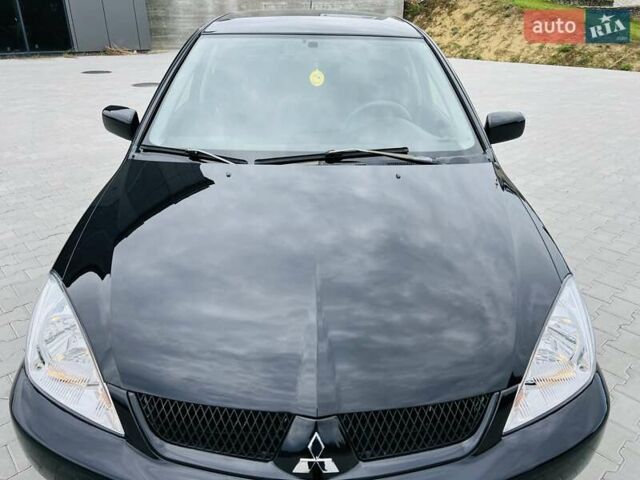 Чорний Міцубісі Lancer, об'ємом двигуна 1.6 л та пробігом 243 тис. км за 4950 $, фото 5 на Automoto.ua