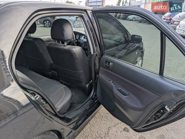 Чорний Міцубісі Lancer, об'ємом двигуна 2 л та пробігом 152 тис. км за 5500 $, фото 12 на Automoto.ua