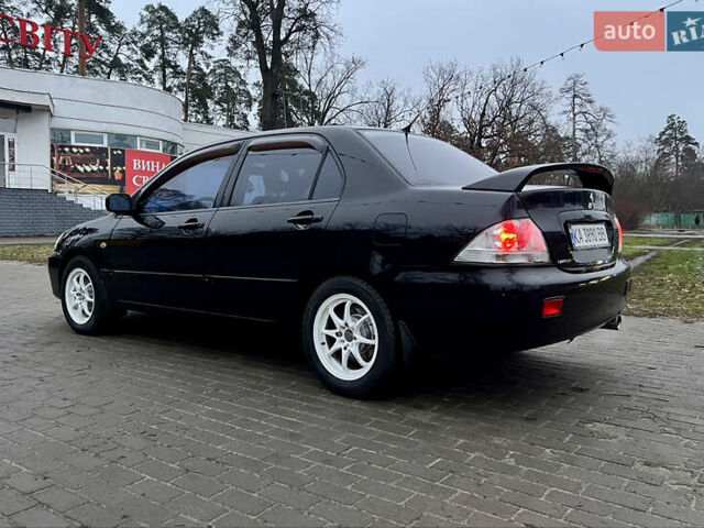 Чорний Міцубісі Lancer, об'ємом двигуна 1.6 л та пробігом 303 тис. км за 4350 $, фото 10 на Automoto.ua