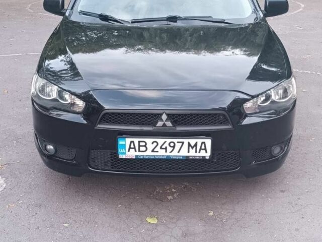 Черный Мицубиси Лансер, объемом двигателя 2 л и пробегом 210 тыс. км за 6000 $, фото 1 на Automoto.ua