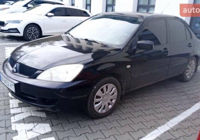 Черный Мицубиси Лансер, объемом двигателя 1.6 л и пробегом 223 тыс. км за 4300 $, фото 5 на Automoto.ua